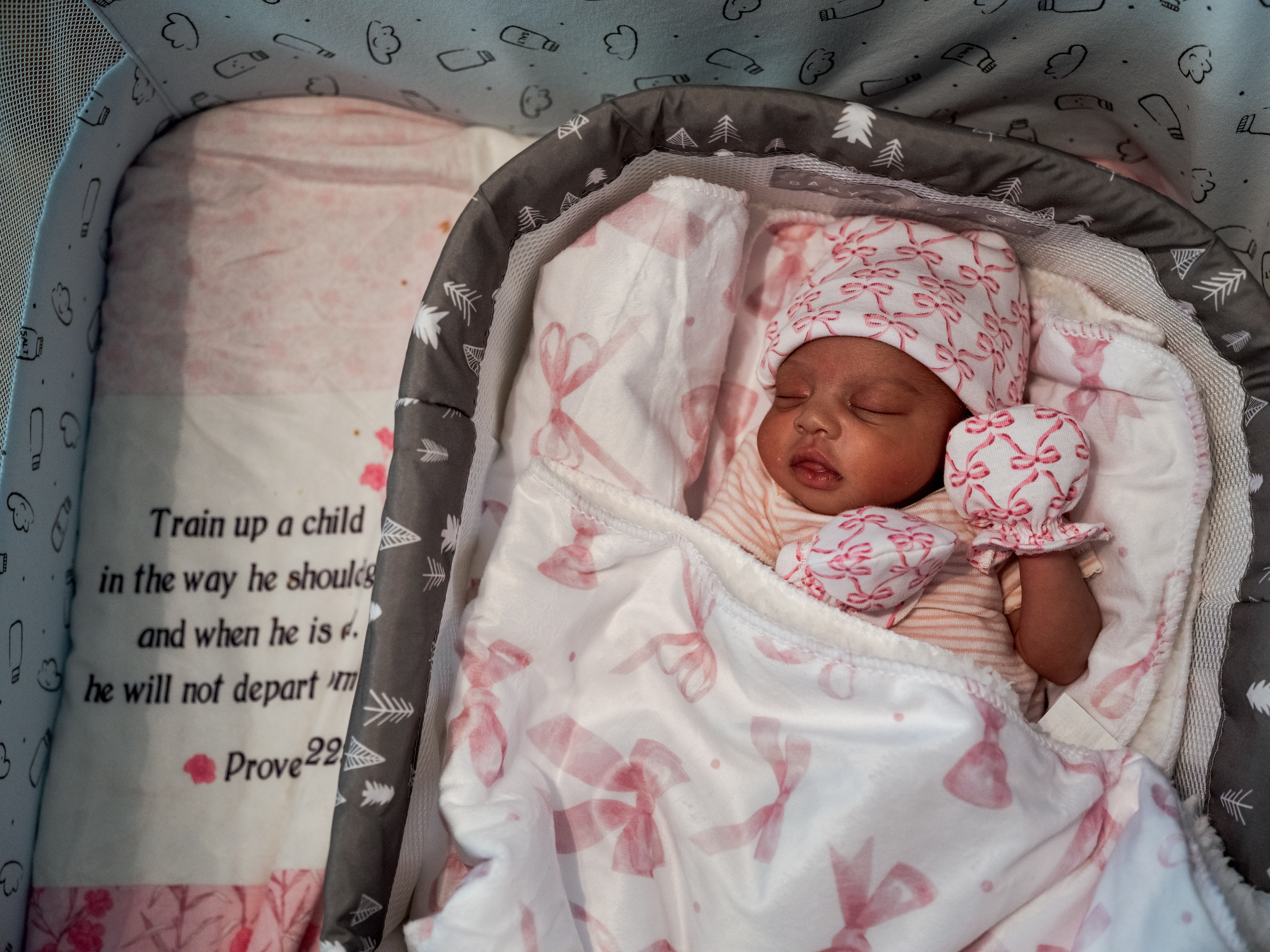 Kaomi Holmes, 10 days old, sleeps in her crib at her home in Greenville, Miss. She was delivered by emergency cesarian section and weighed 4.5 pounds at birth.
